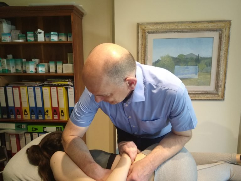 A massage therapist working on a client's back.