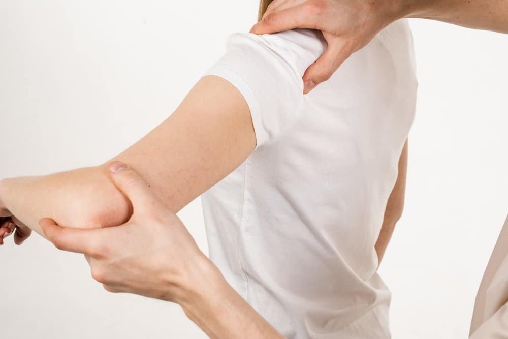 Man having osteopathic treatment on arm