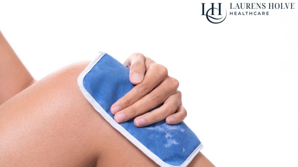 A person holds a blue ice pack on their knee. The Laurens Holve Healthcare logo is visible in the top right corner.